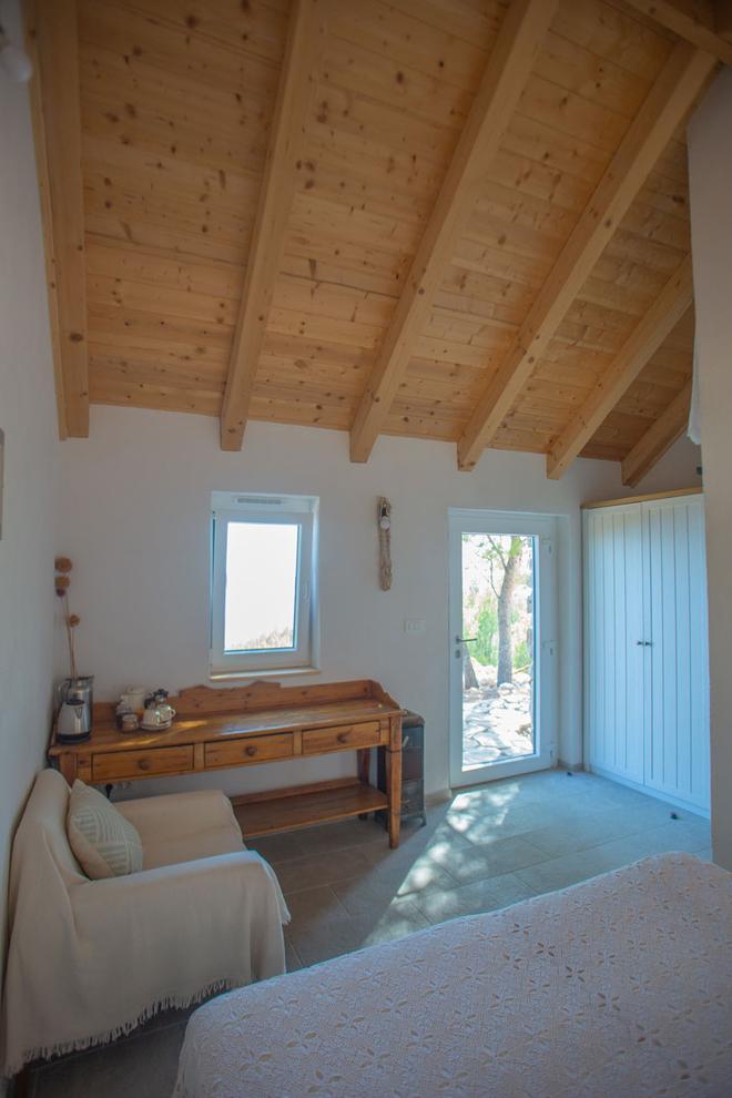 Room B bed, sideboard and armchair